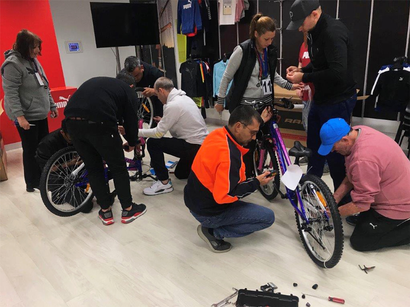 PUMA employees building bicycles