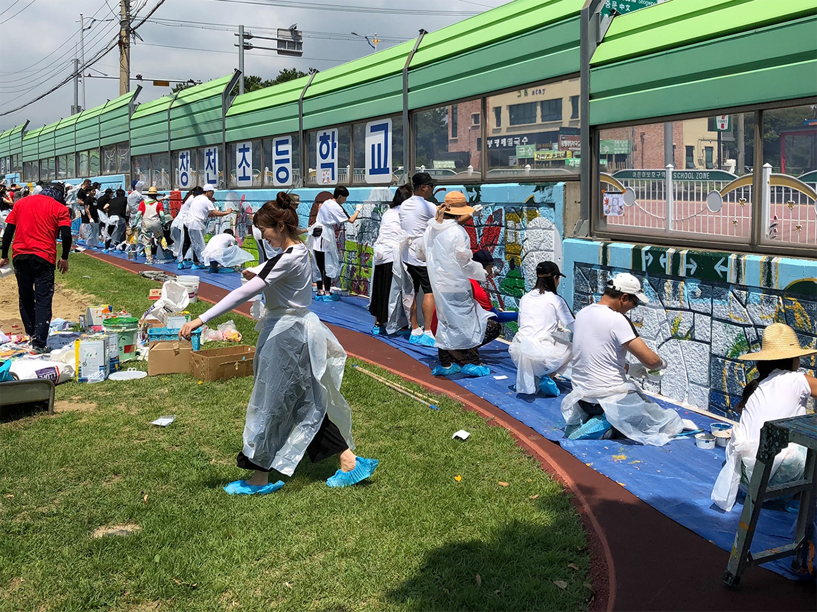 PUMA employees painting walls