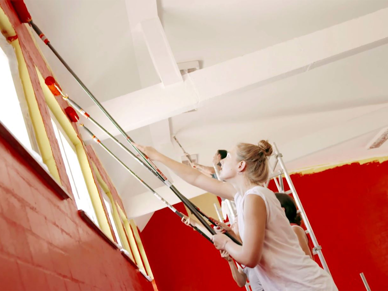 PUMA employees painting walls