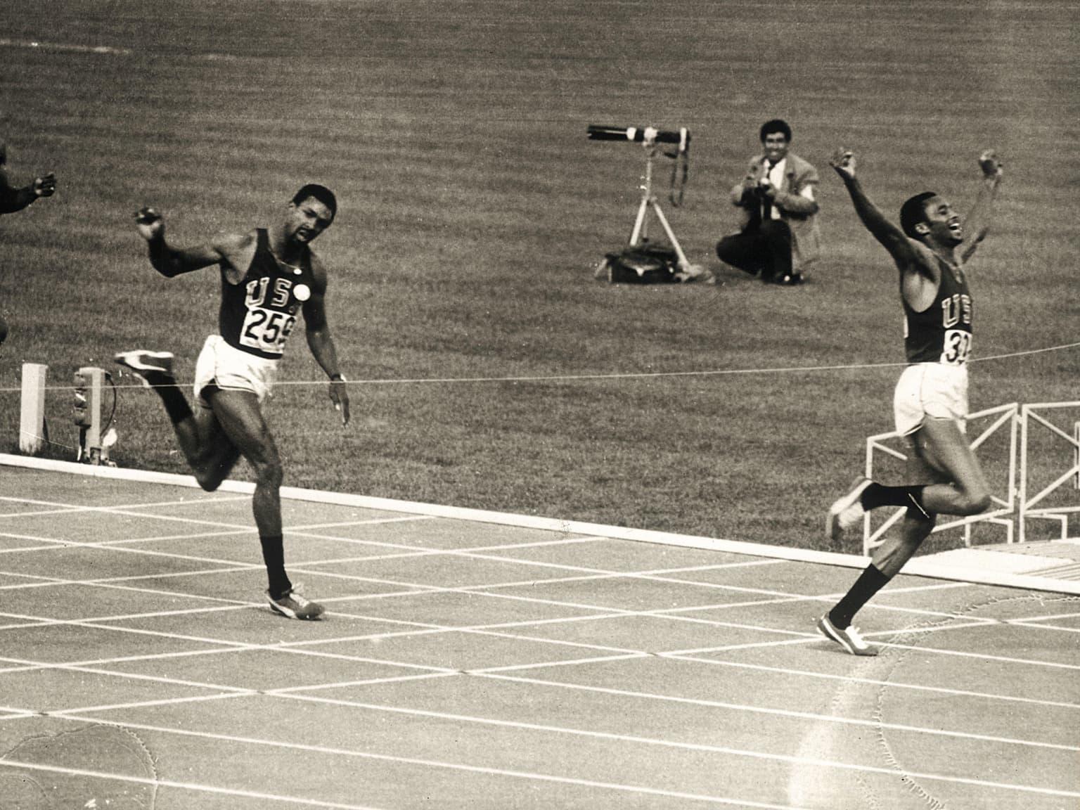 Strong athletic black skin woman sprinter, running on background