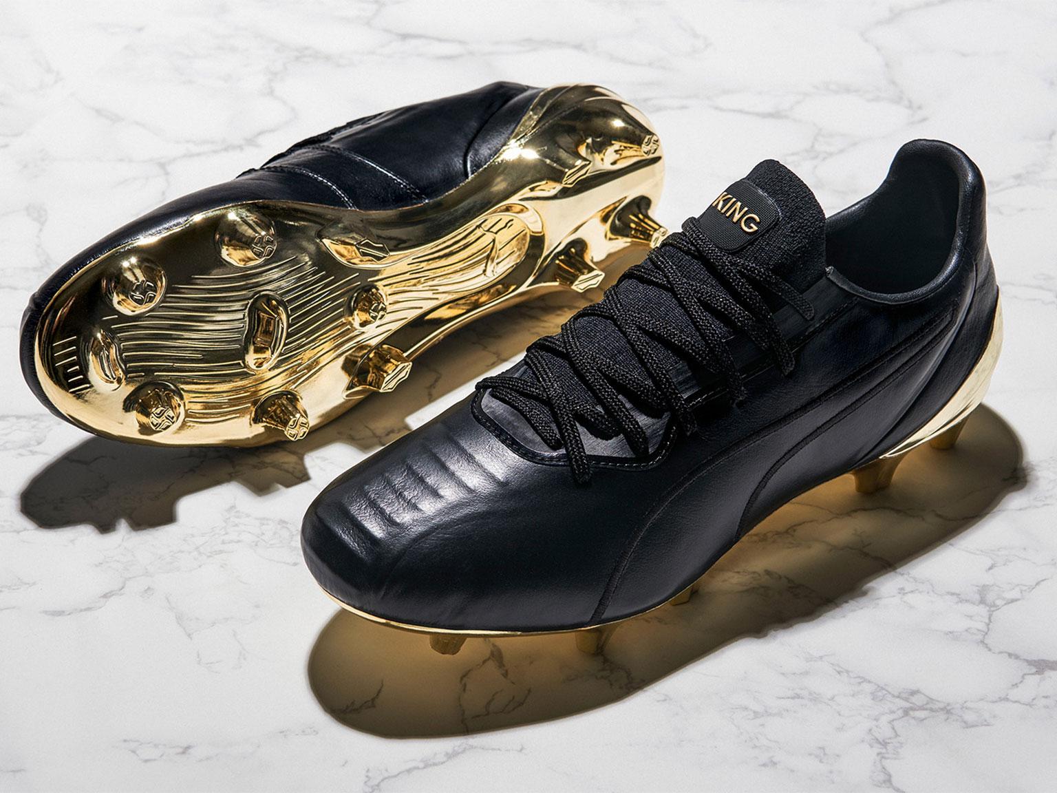 Puma king store black and gold