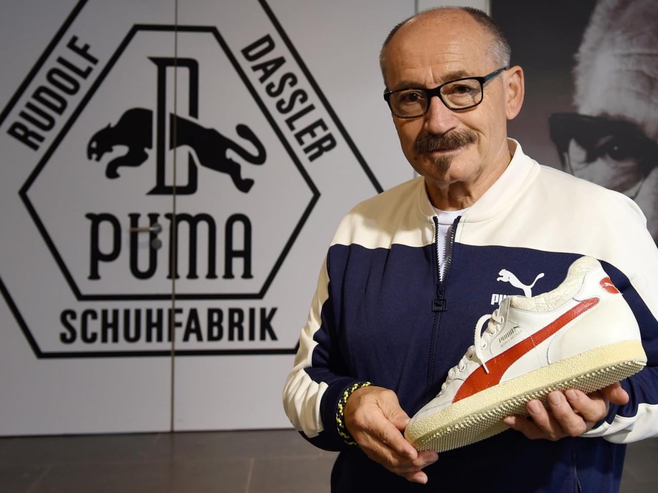 Helmut Fischer presenting a PUMA sneaker