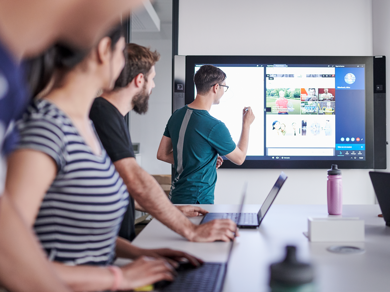 PUMA employees watching a screen