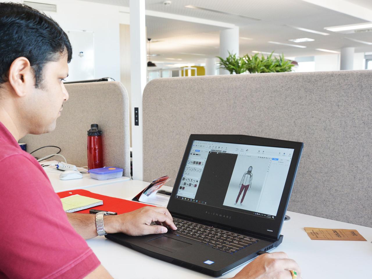 PUMA Product Development employee working on a laptop