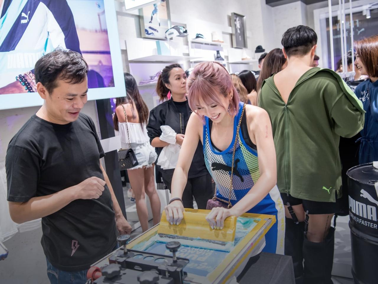 PUMA employees talk to customers in the PUMA store