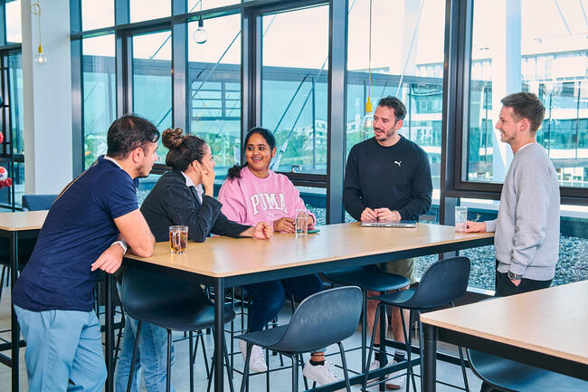 PUMA Employees sitting at a table in the cafeteria 
